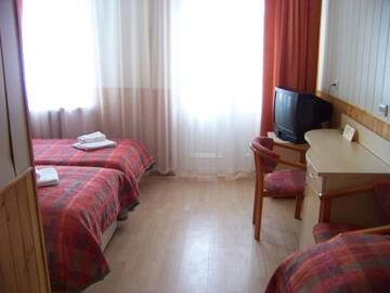 Фото номера Двухместный номер с 2 отдельными кроватями Отель Hotel Dainava г. Друскининкай 4